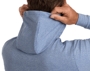 The Hamilton Hoodie: Heathered Maidstone Blue & White, showcasing fine stripes, 4-way stretch, and UPF 50+, with a person adjusting the hood's edge.