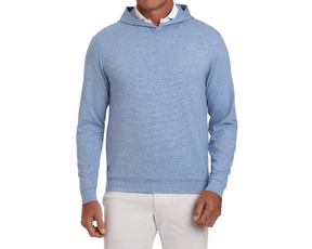 The Hamilton Hoodie: Heathered Maidstone Blue & White on model, showcasing its lightweight design over a white collared shirt, paired with beige trousers.