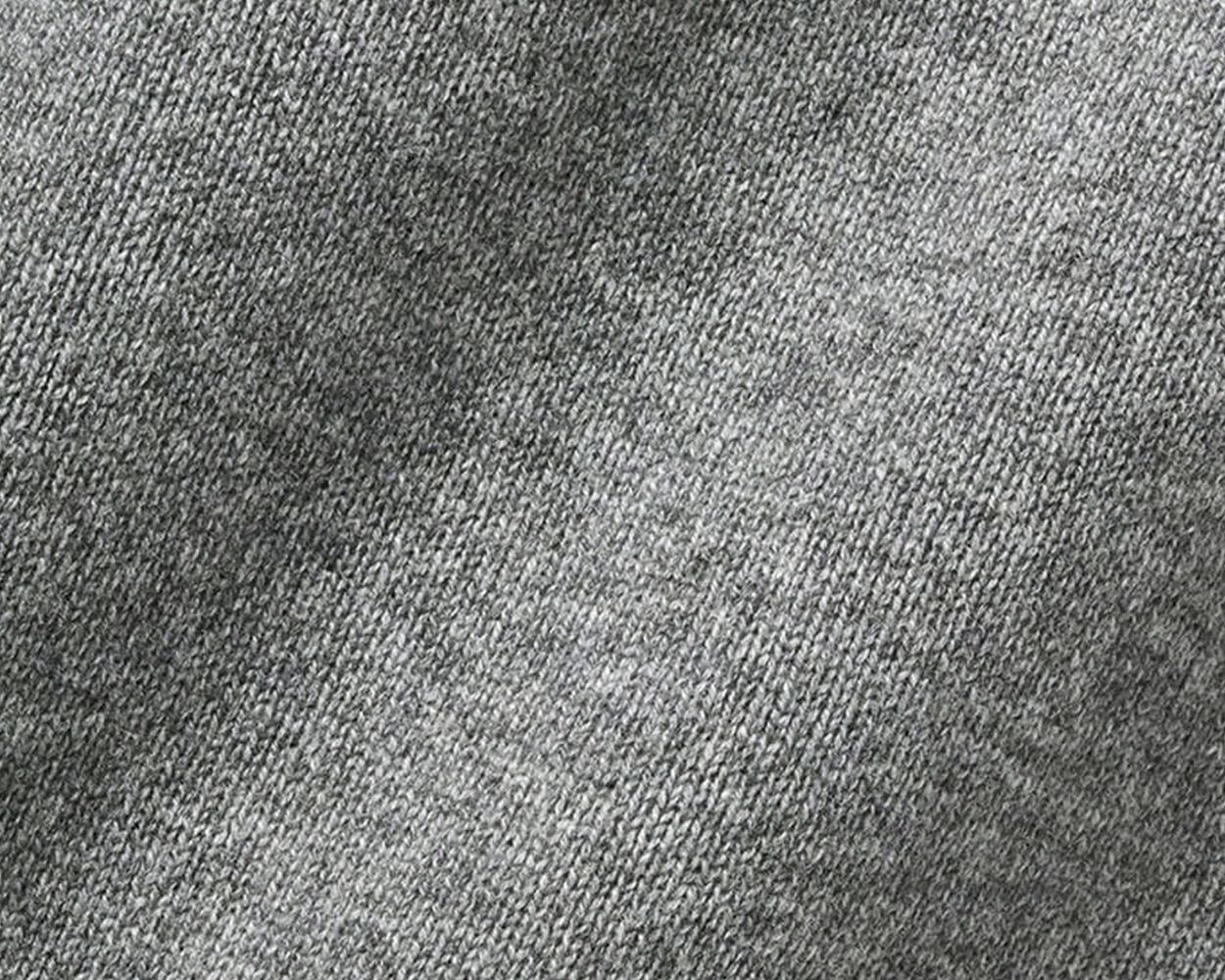 The Berwick Crewneck Sweater: Heathered Gray, close-up view showcasing its plush, three-ply Scottish cashmere knit with reinforced cuffs, highlighting premium texture and craftsmanship.