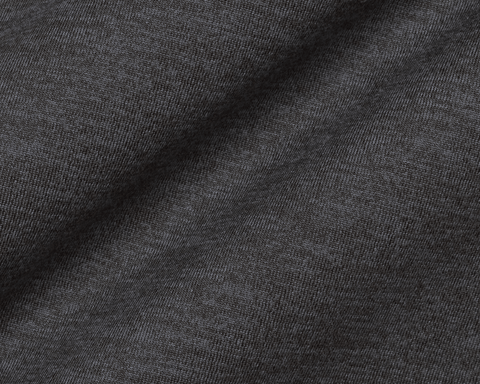 Close-up of The Stowe Hoodie: Heathered Dark Charcoal, showing the fine heathered knit texture and soft drape of the lightweight performance fabric.