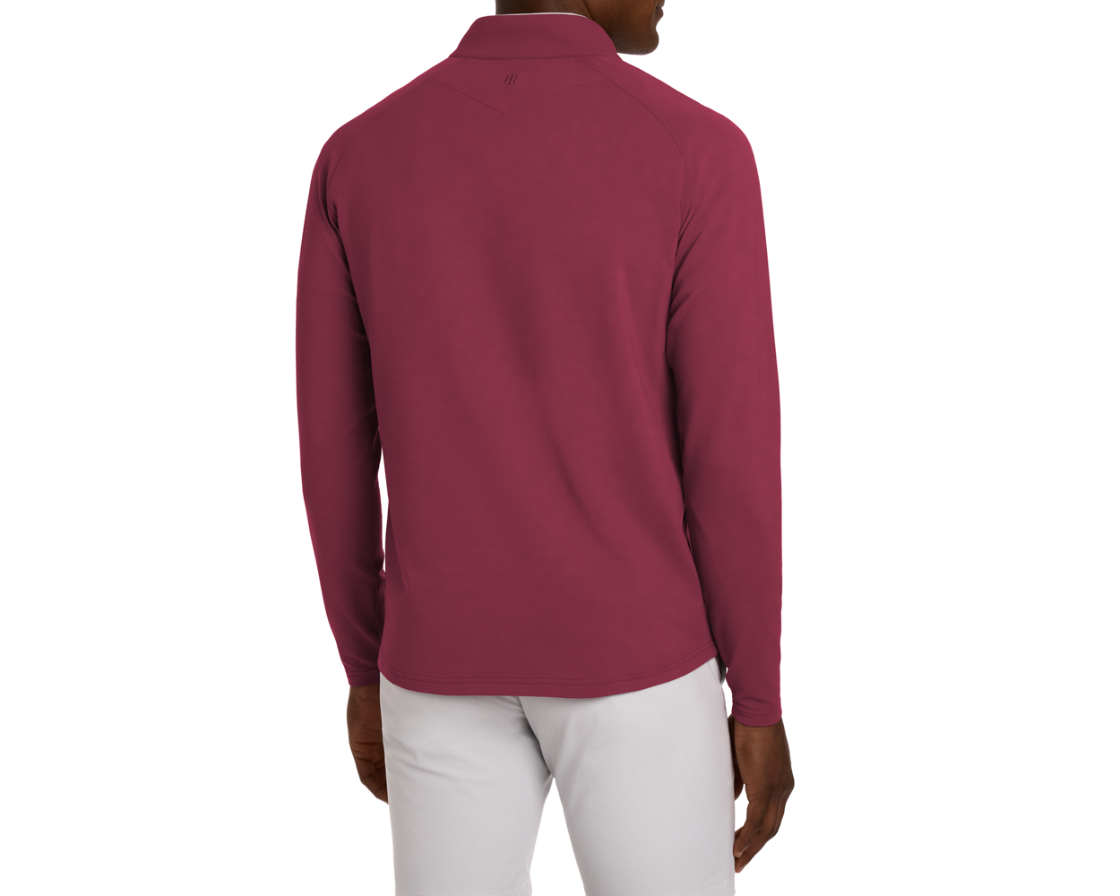 Model wearing The Stuart Quarter-Zip: Cabernet, showing back view with textured rib fabric and luxurious performance blend, paired with light gray bottoms against a white backdrop.