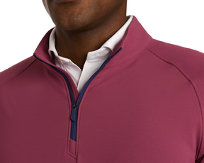 Person wearing The Stuart Quarter-Zip: Cabernet, showcasing its luxurious performance blend and subtle textured rib fabric with a visible white shirt collar underneath.