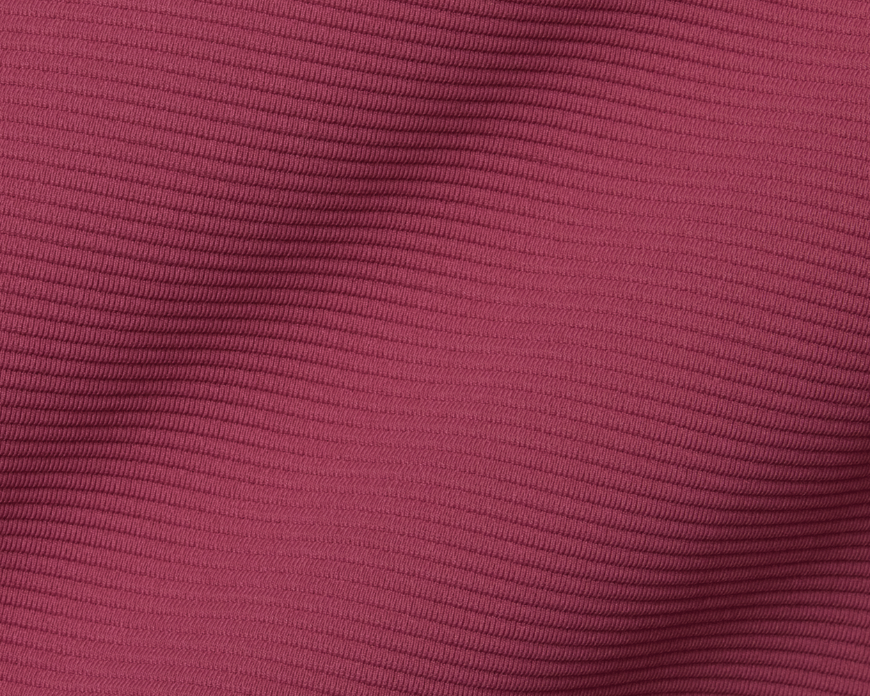 Close-up of The Stuart Quarter-Zip: Cabernet, showcasing its ribbed knit texture with subtle folds, emphasizing the luxurious, lightweight, performance fabric's quality.