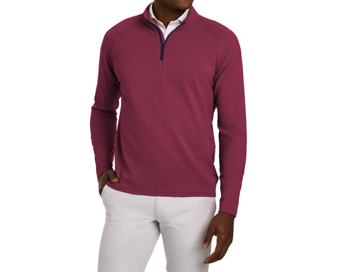 Person wearing The Stuart Quarter-Zip: Cabernet, featuring a textured rib fabric over a white collared shirt, paired with light gray pants.