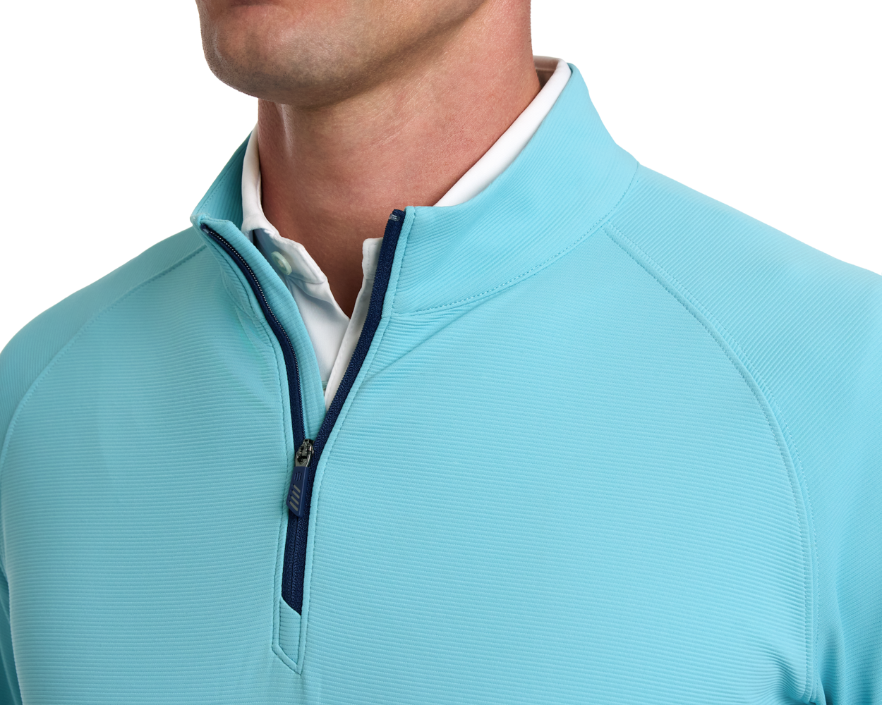 The Stuart Quarter-Zip: Harbor showcases a ribbed texture and navy zipper, layered over a white shirt, highlighting its luxurious performance blend.