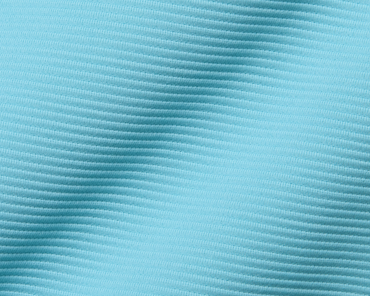 Close-up of The Stuart Quarter-Zip: Harbor, showcasing its light turquoise ribbed fabric with horizontal ridges, highlighting its luxurious texture and lightweight performance blend.
