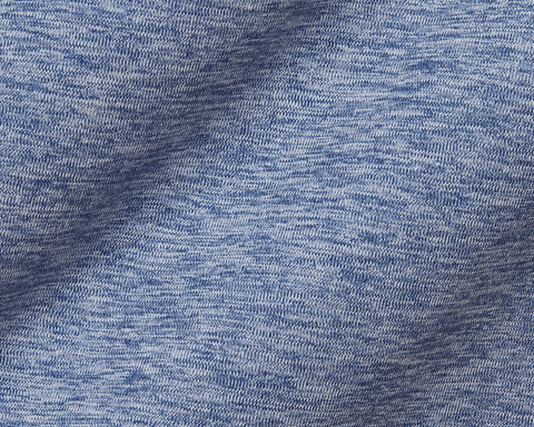 The Dunbar Hoodie: Heathered Andover, showcasing a close-up of its light blue, heathered knit fabric with fine interlocking stitches, highlighting texture and draping.