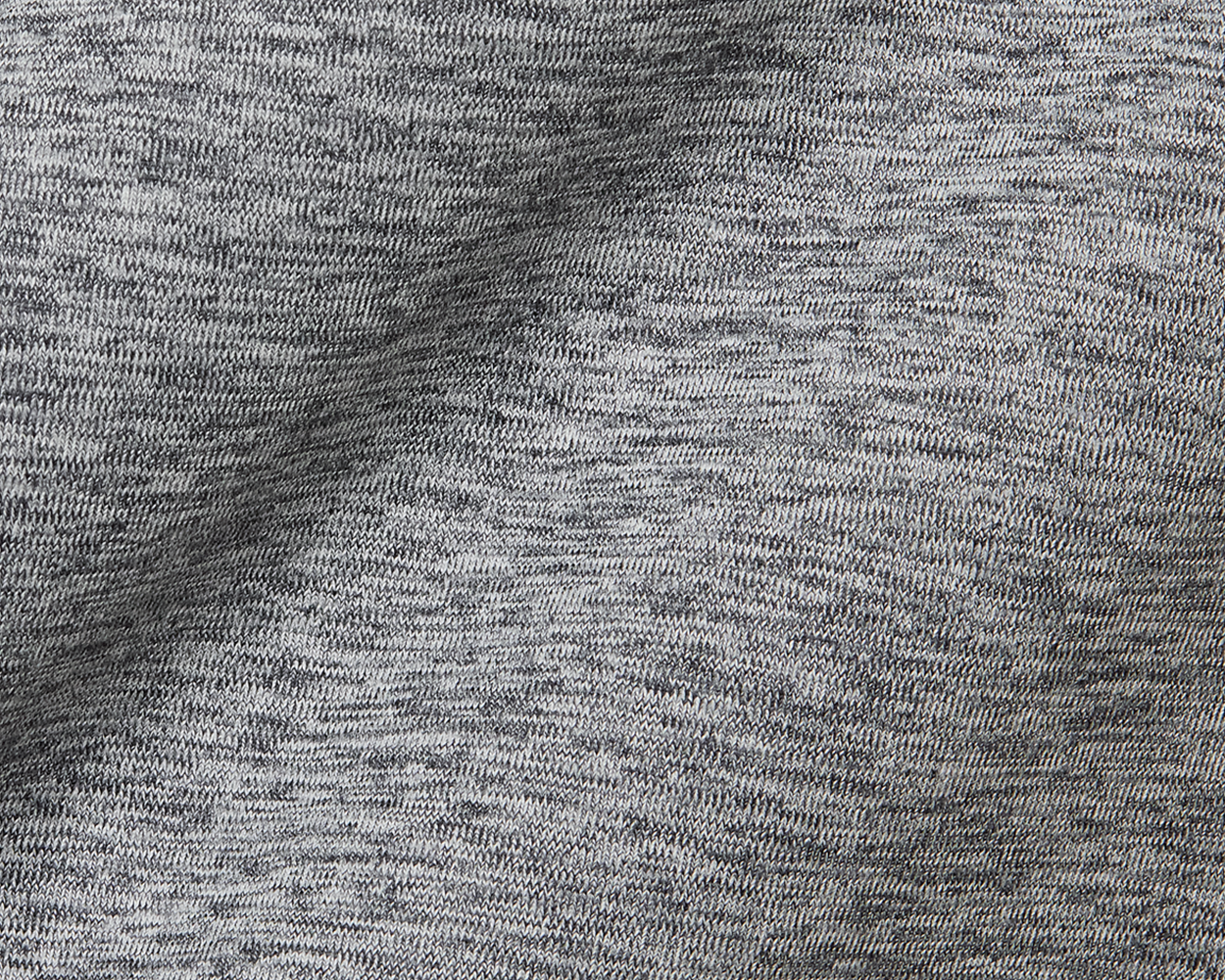 Close-up of The Dunbar Hoodie: Heathered Charcoal, showcasing its soft, breathable knit fabric with visible loops, designed for active wear with advanced UPF 50+ protection.