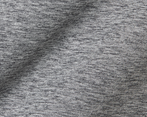 Close-up of The Dunbar Hoodie: Heathered Charcoal, showcasing its soft, breathable knit fabric with visible loops, designed for active wear with advanced UPF 50+ protection.