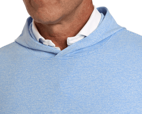 Person wearing The Hamilton Hoodie: Heathered Horizon Blue & White, showcasing its lightweight, fine-striped design with a white collared shirt underneath for versatile comfort.