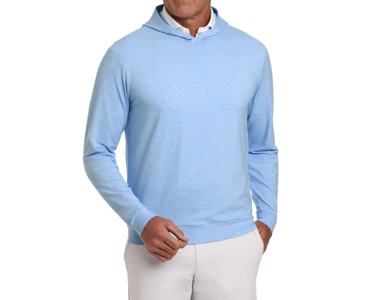 The Hamilton Hoodie: Heathered Horizon Blue & White, shown layered over a white collared shirt with light-beige trousers, features a subtle stripe and 4-way stretch.
