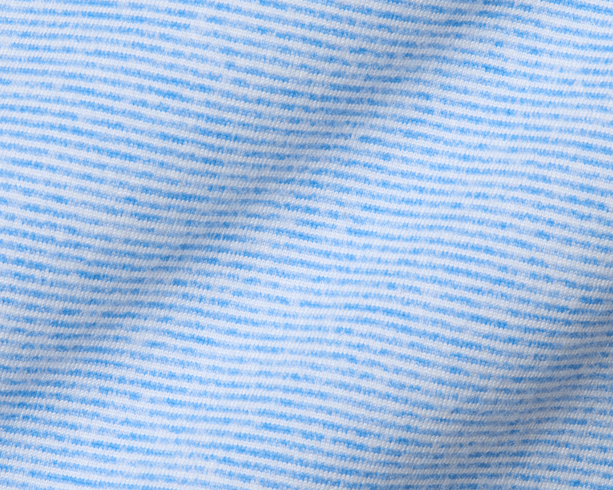 Close-up of The Hamilton Hoodie in Heathered Horizon Blue & White, showcasing its fine knit stripes, soft fabric, and subtle folds for comfort and stretch.