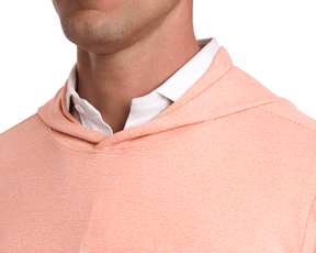 Close-up of a person wearing The Hamilton Hoodie in Heathered Nectarine & White, showcasing its fine-striped design, lightweight fabric, and hooded style.