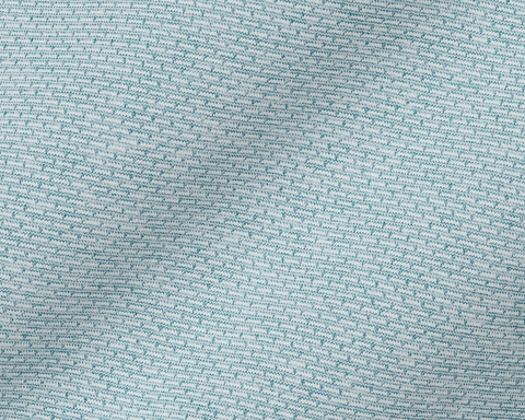 The Bell Quarter-Zip: Heathered Harbor features a close-up of its light teal-blue and off-white knitted fabric, showcasing the textured, breathable jersey-knit fabric.