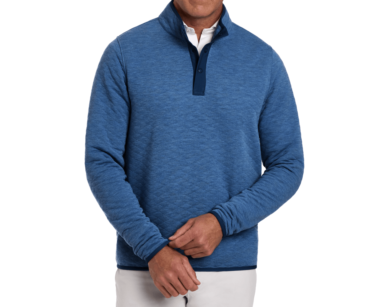 Man wearing The Sullivan Quarter-Snap: Heathered Maidstone Blue pullover, showcasing its diamond-quilted insulation and classic contrasting trim over a white collared shirt.