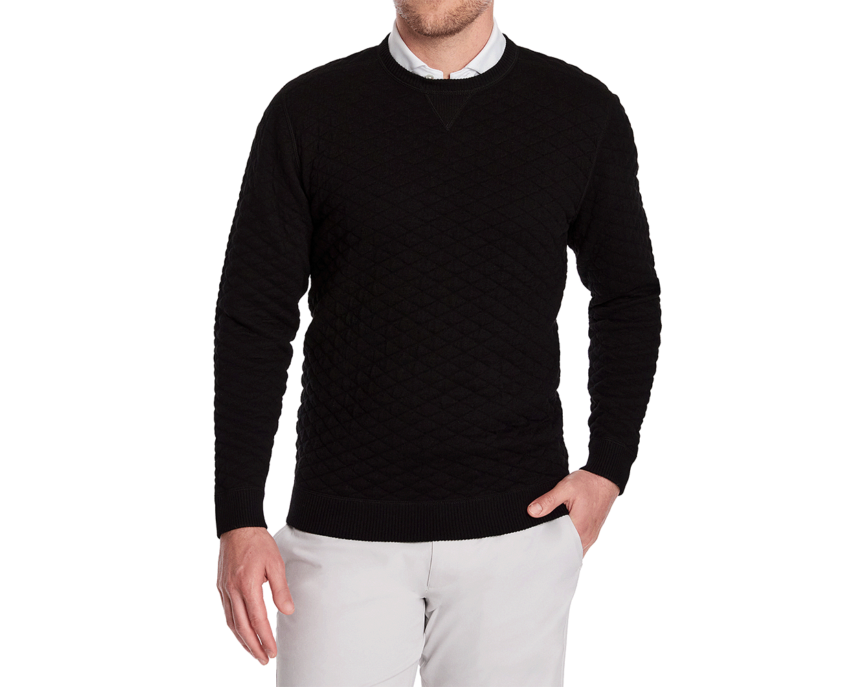 The Ward Crewneck Sweater: Black, featuring a diamond-quilted pattern over a white collar, worn by a male model with light trousers, showcasing its elegant versatility.