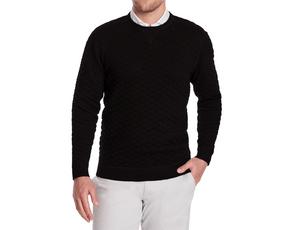 The Ward Crewneck Sweater: Black, featuring a diamond-quilted pattern over a white collar, worn by a male model with light trousers, showcasing its elegant versatility.