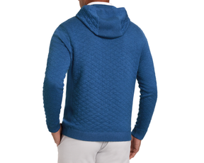Model wearing The Wallace Hoodie Sweater in quilted-stitch design, featuring ribbed hem and cuffs, showcasing a sleek back profile with hood down.
