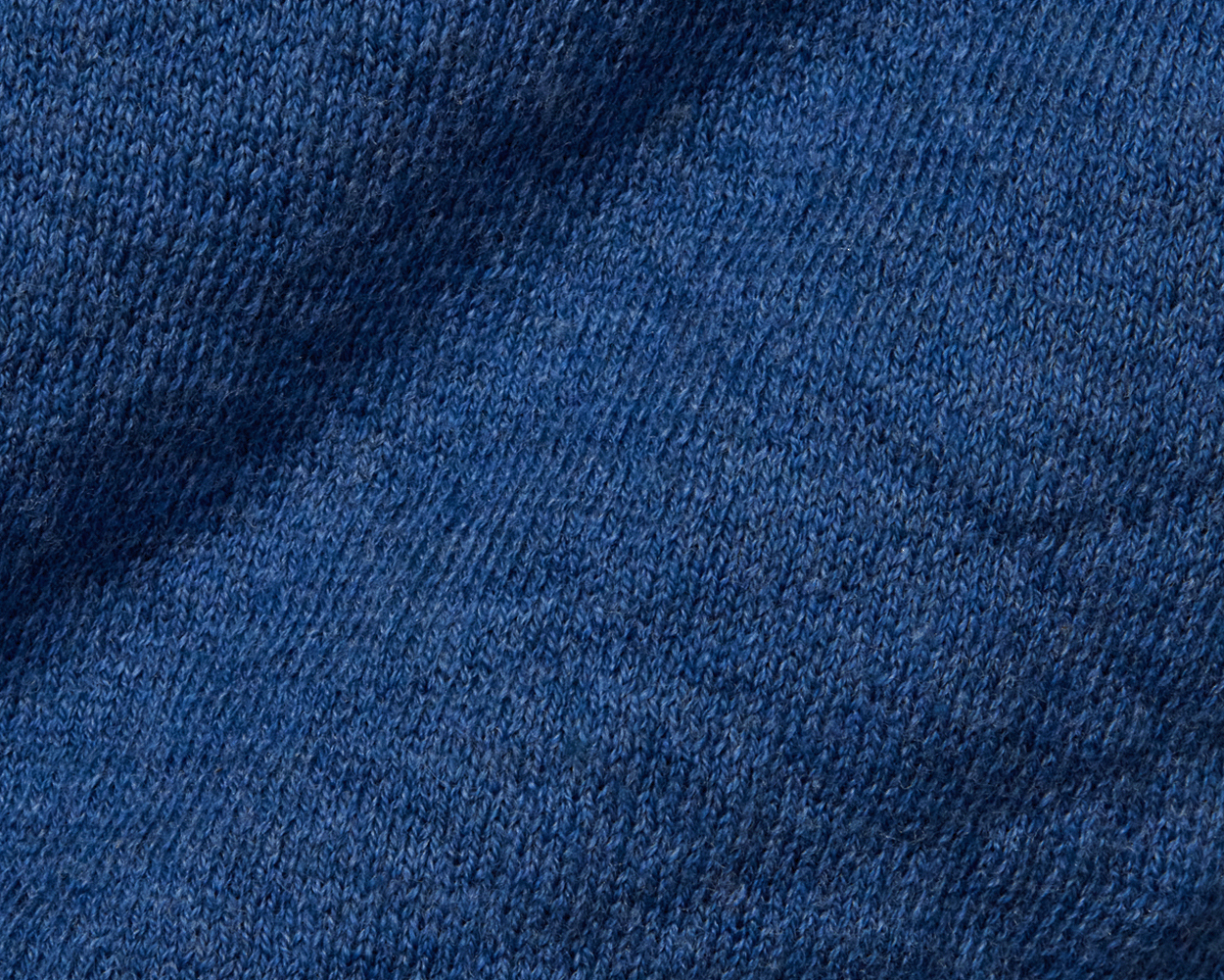 The Wallace Boys Hoodie Sweater: Heathered Maidstone Blue showcases a close-up of its jacquard-knit pattern, highlighting detailed loops and ribbed side panels.