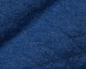 The Wallace Boys Hoodie Sweater: Heathered Maidstone Blue showcases a close-up of its jacquard-knit pattern, highlighting detailed loops and ribbed side panels.