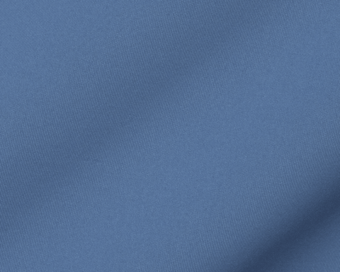 Close-up of The Rodgers Quarter-Zip: Pacific Blue fabric showing its fine diagonal woven texture in a mid blue, from a stretchy midweight knit.