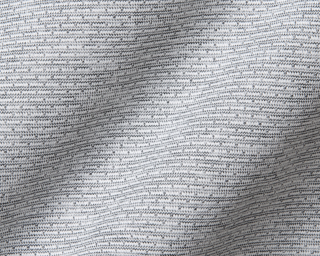 Close-up of The Bell Quarter-Zip: Heathered Gray, showcasing fine knit texture, highlighting its lightweight, breathable fabric for comfort and sporty, sophisticated style.