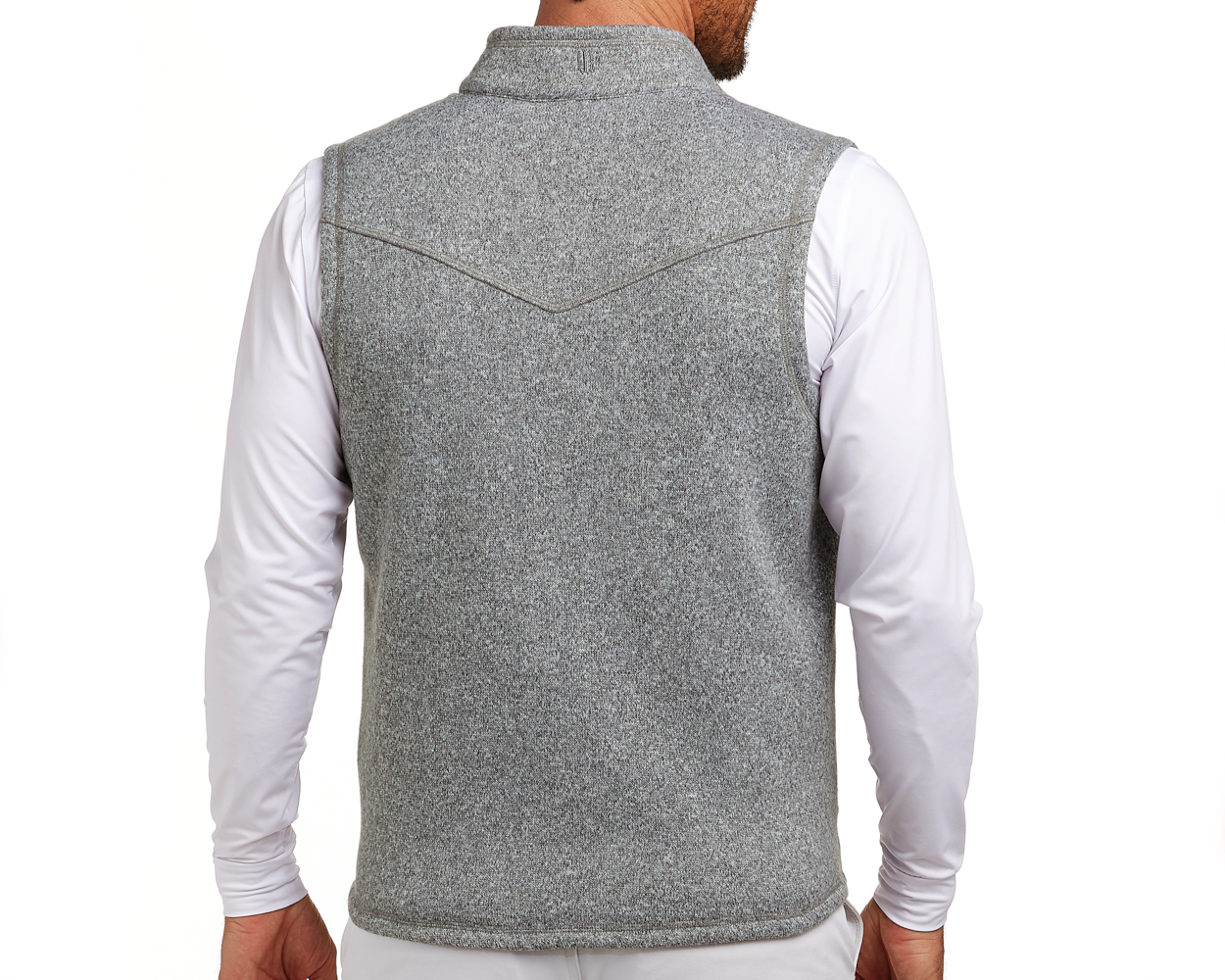 The Ashby Vest: Heathered Gray, shown from the back, features a sleeveless design over a white shirt, with tonal accents and a brushed interior for comfort.