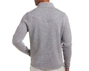 The Ashby Jacket: Heathered Gray, featuring a V-shaped yoke seam and turned-up collar, worn by a person with their hand on their hip.