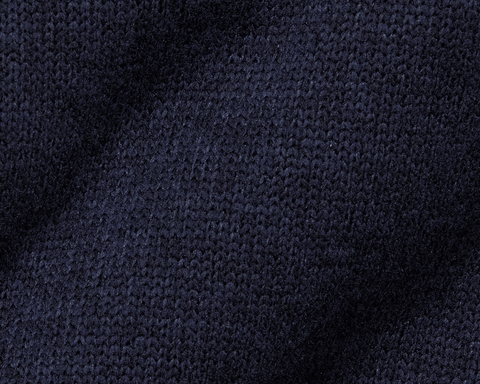 The Ashby Vest: Heathered Dark Navy, showcasing a close-up of its knitted texture, features stylish tonal accents and low-profile pockets for everyday comfort and versatility.