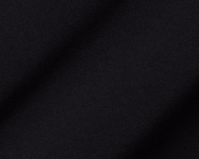Close-up of The Boyd Vest: Black fabric, showcasing its fine woven texture and soft folds, highlighting the vest's windproof and water-resistant qualities.