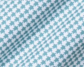 Close-up of The Kitts Boys Shirt: Harbor, showcasing a turtle print in a houndstooth pattern on soft, breathable DryLuxe jersey fabric with structured collar.