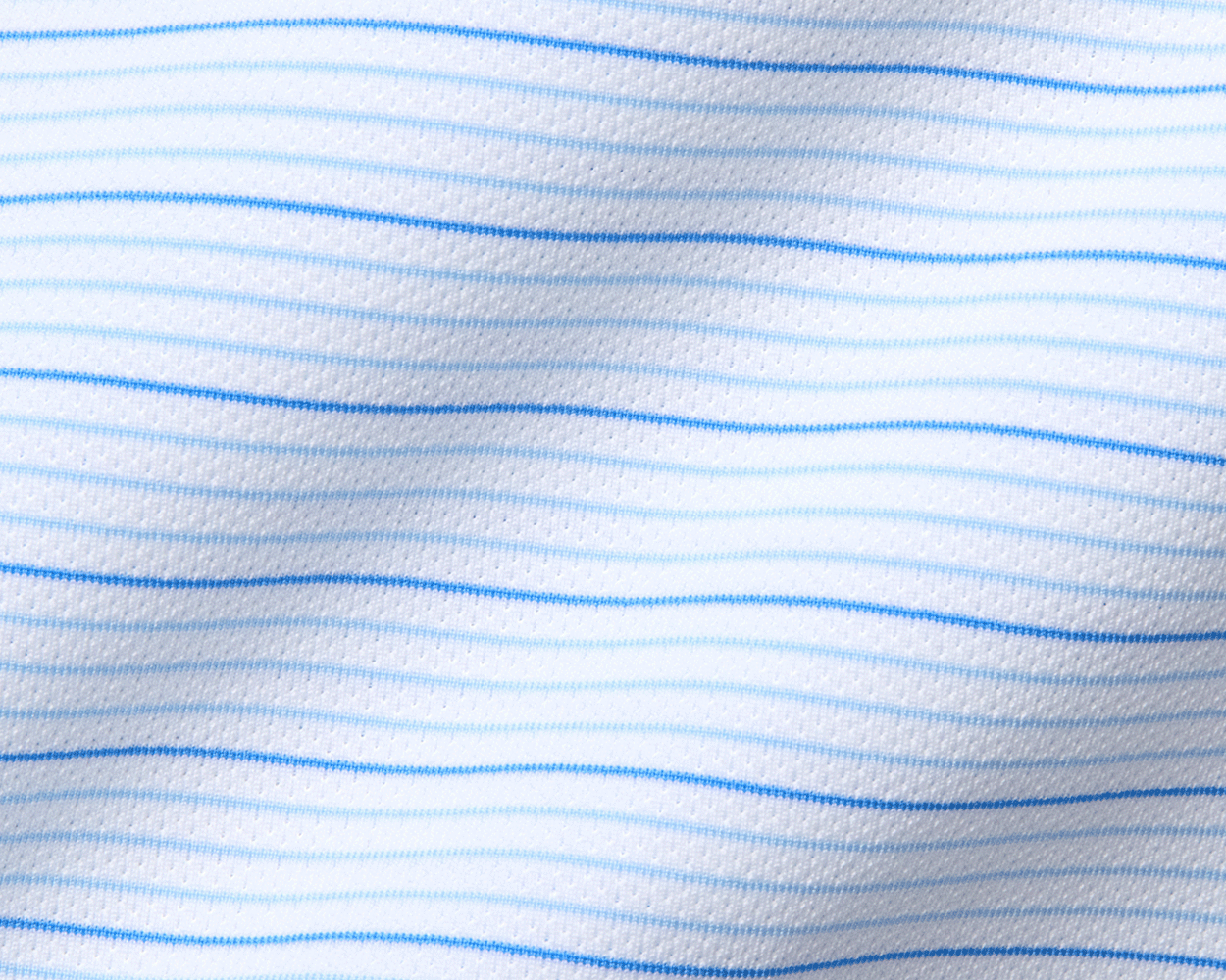 Close-up of The Stanley Shirt's fine horizontal stripes, showcasing its breathable AIRATION® fabric with micro perforations for enhanced air circulation and comfort.