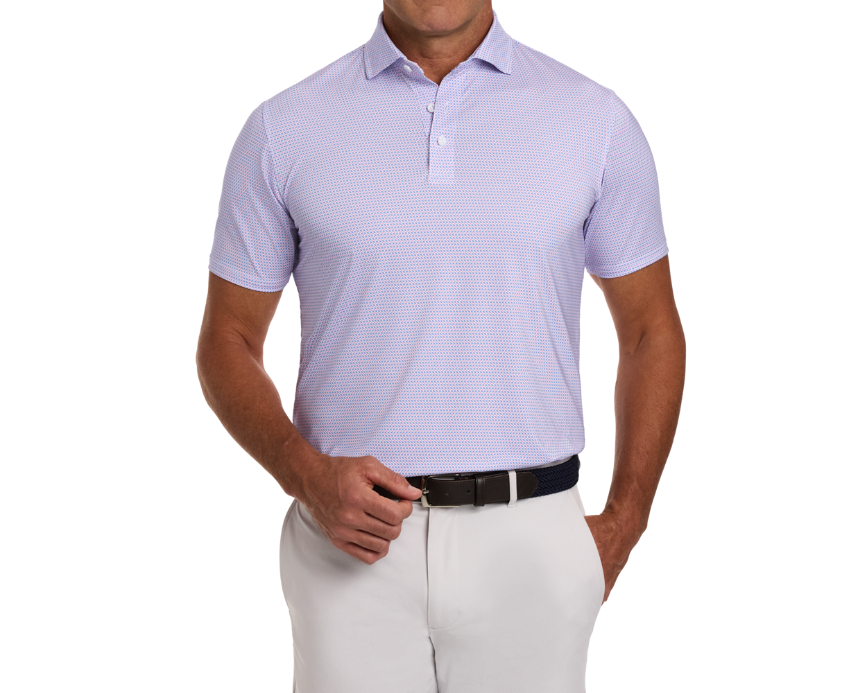 Man wearing The Norman Shirt: Belmont & Horizon Blue, featuring a subtle geometric pattern, short sleeves, and a structured spread collar, paired with light trousers and a dark belt.