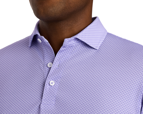 The Eaton Shirt: Tudor, featuring a textured micro-pattern, spread collar, and light buttons, designed for comfort and sun protection, ideal for warm-weather wear.