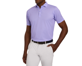 The Eaton Shirt: Tudor, a short-sleeve polo with abstract wave pattern, two-button placket, structured spread collar, worn tucked into light-gray trousers.