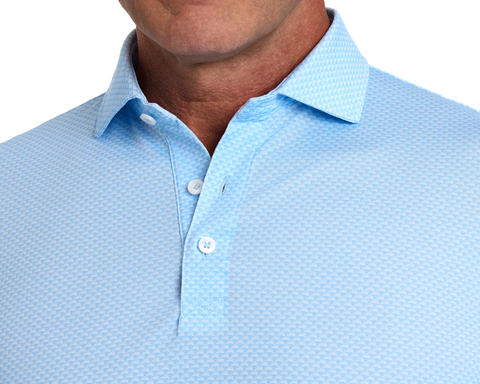 Close-up of The Eaton Shirt: Vista Blue, showcasing its textured fabric, structured spread collar, and fastened buttons, designed for moisture wicking and UPF 30+ protection.