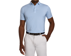 The Justice Shirt: Harbor & Maidstone Blue features a light-blue polo with an eagle pattern, tucked into light-gray trousers, styled with a dark woven belt.
