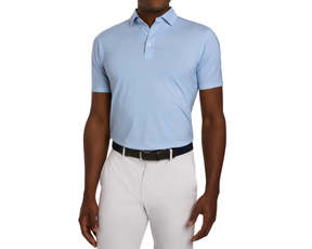 Male model wearing The Justice Shirt: Harbor & Maidstone Blue, a geometric print polo, tucked into light gray golf pants with a dark belt.