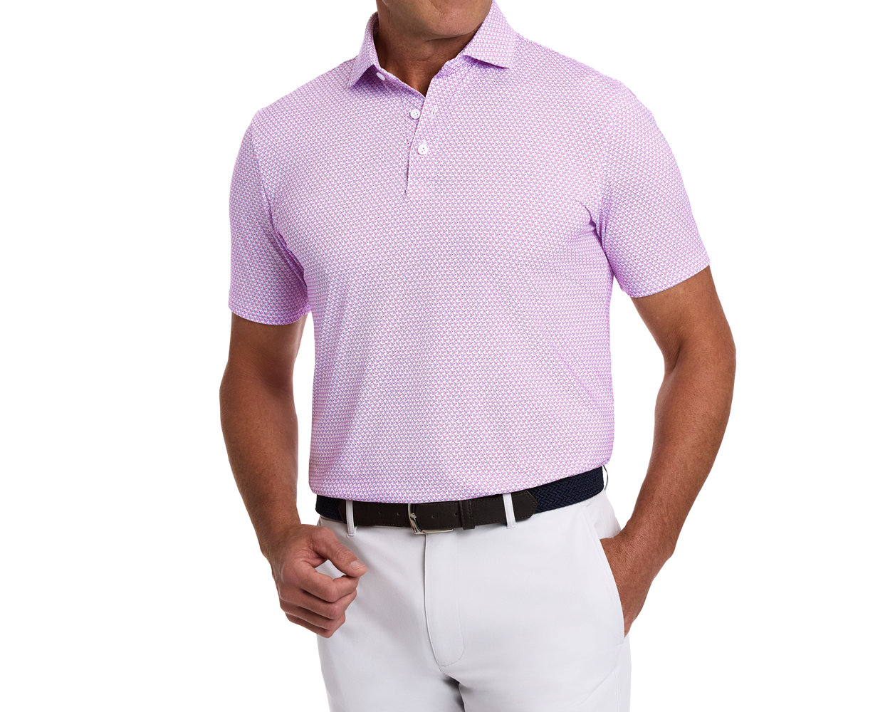 Man wearing The Justice Shirt with stylized eagle pattern, a polo in pinkish-lavender, paired with light trousers and a dark woven belt.