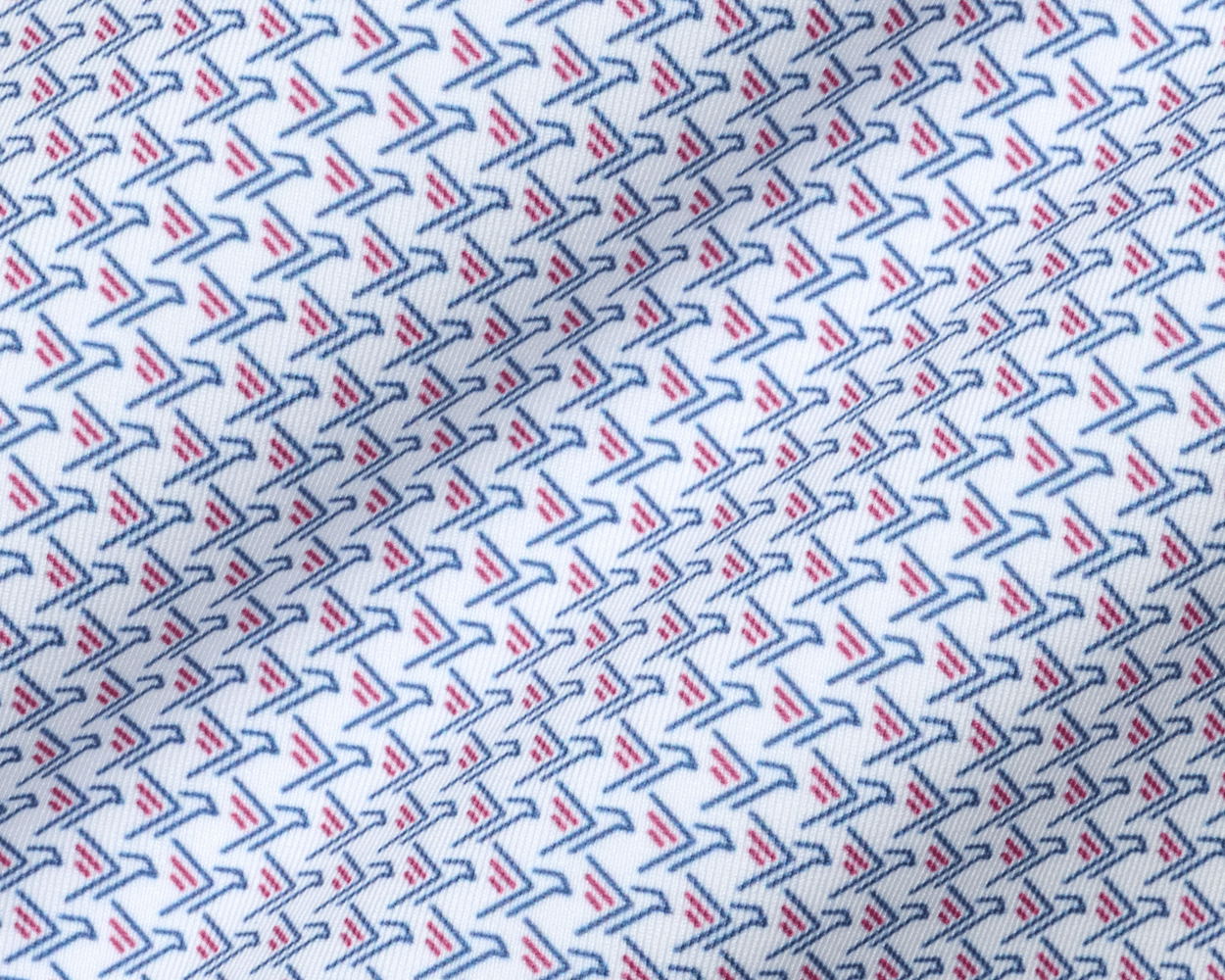 Close-up of The Justice Shirt: Napa & Pacific Blue fabric showing its blue and red stylized print on white, with a soft performance jersey feel.