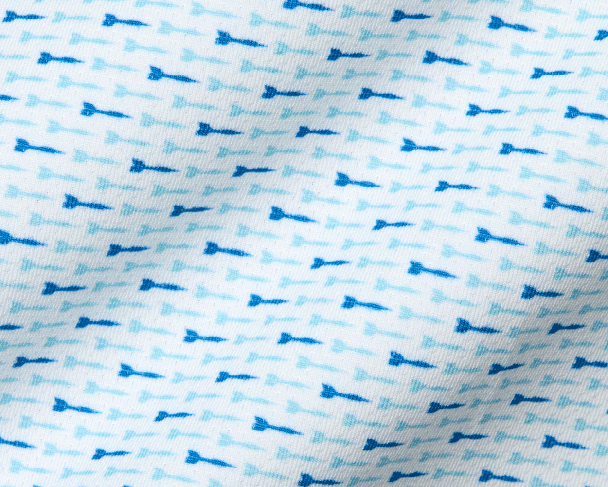 The Cadogan Shirt: Harbor & Maidstone Blue, showcasing a close-up of breathable fabric with tiny blue arrow motifs, highlighting its soft, moisture-wicking texture and structured collar.