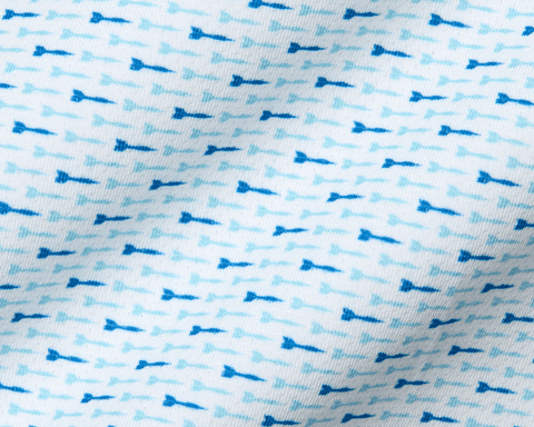 The Cadogan Shirt: Harbor & Maidstone Blue, showcasing a close-up of breathable fabric with tiny blue arrow motifs, highlighting its soft, moisture-wicking texture and structured collar.