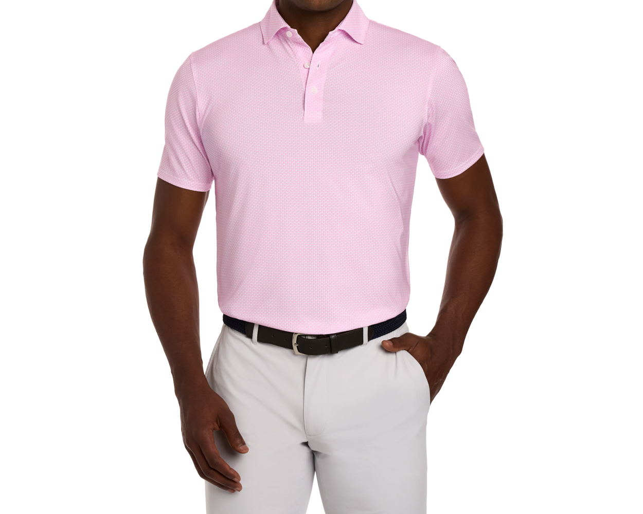 The Hanover Shirt: Belmont, a short-sleeve polo with a geometric pattern, worn tucked into trousers, featuring a structured spread collar and dark woven belt.