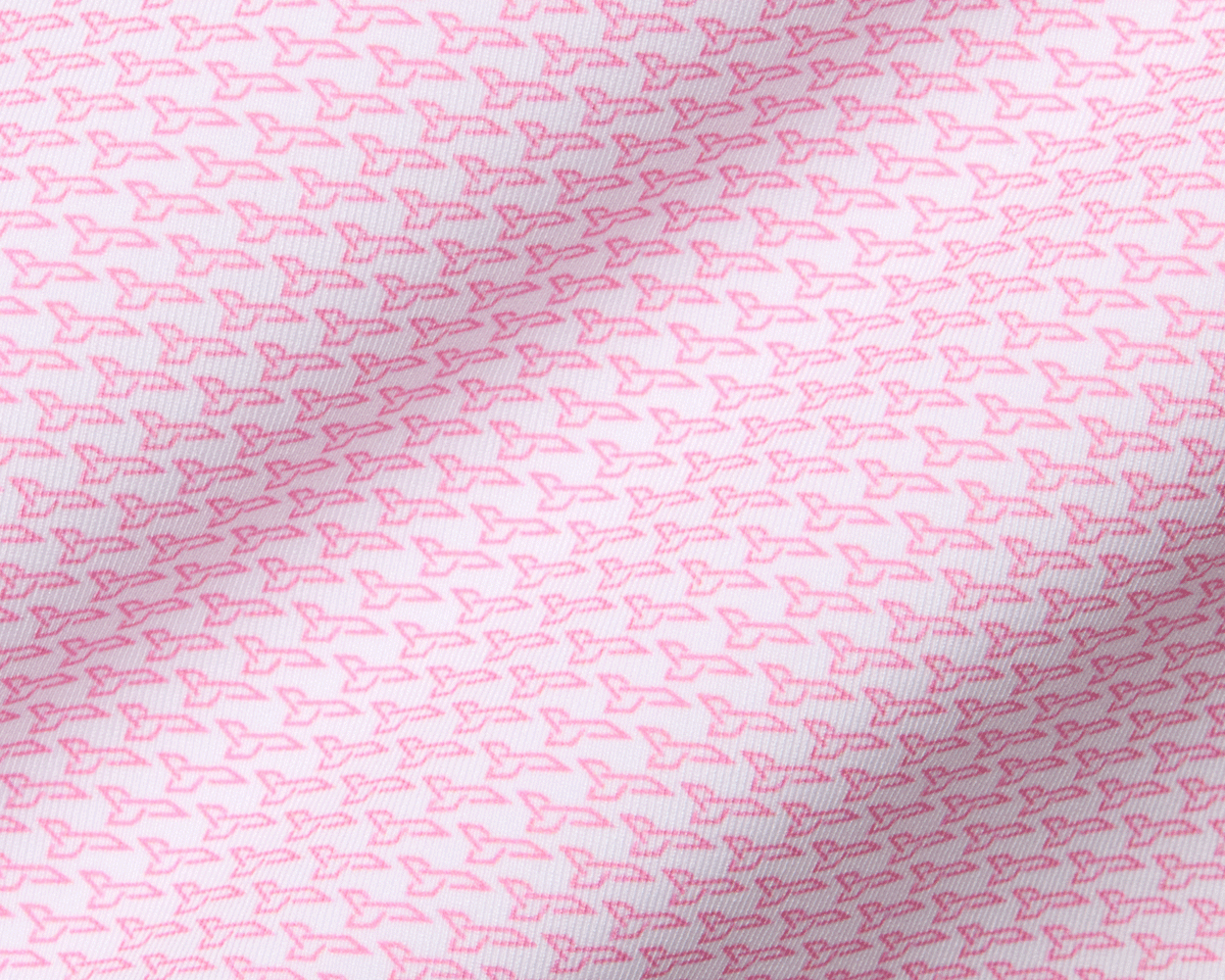 Close-up of The Hanover Shirt: Belmont, showcasing its geometric boomerang pattern on soft fabric, highlighting fine ribbing and folds for a textured, breathable design.