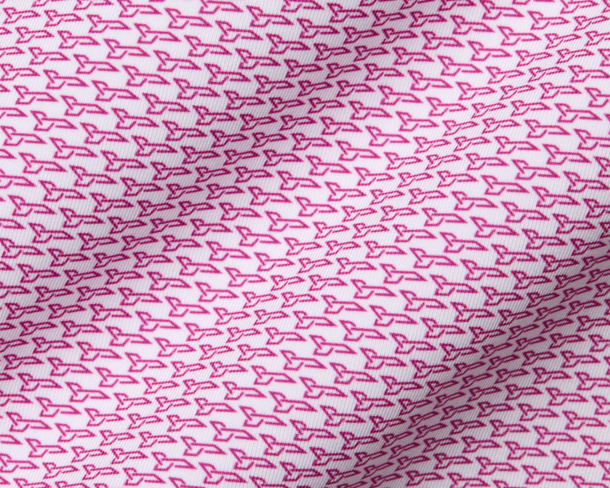 The Hanover Shirt: Cabernet, featuring a close-up of its geometric pattern with pink arrow-like shapes, highlighting its performance jersey fabric and structured spread collar.