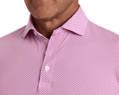 Man wearing The Hanover Shirt: Cabernet, a long-sleeve dress shirt with a geometric pattern, top button undone, showcasing the structured spread collar and performance fabric.