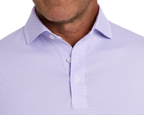 The Hanover Shirt: Tudor featuring a structured spread collar and small geometric pattern, highlighting its super-soft performance fabric with four-way stretch and moisture-wicking properties.
