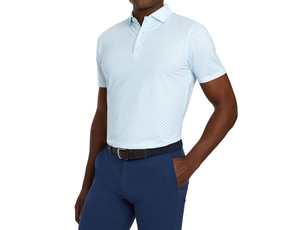 The Cadogan Shirt: Harbor & Maidstone Blue, a light-blue polo with subtle pattern, worn with tailored navy trousers and a dark woven belt.