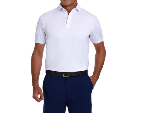 Man wearing The Cadogan Shirt: Tudor & Vista Blue, a breathable, short-sleeve polo with a structured spread collar, tucked into navy trousers.