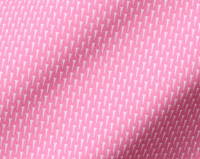 Close-up of The Hicks Boys Shirt: Belmont, showcasing its pink woven fabric with tiny white golf-tee motifs, highlighting its stretchy, moisture-wicking performance jersey.